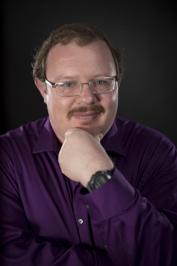Picture of David A. Robinson (PhD student) in purple shirt