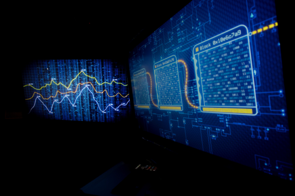 Close up image of codes on a multiple screens.