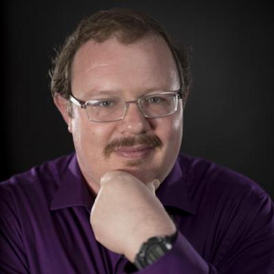 Picture of David A. Robinson (PhD student) in purple shirt